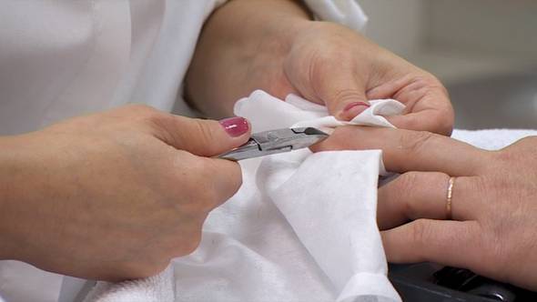 Manicurist Makes Female Manicure