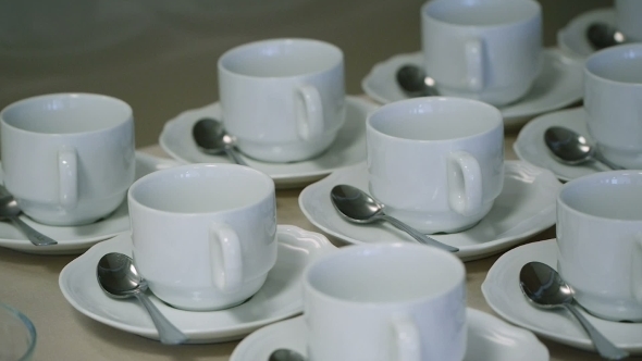 Many White Tea Cups In Table
