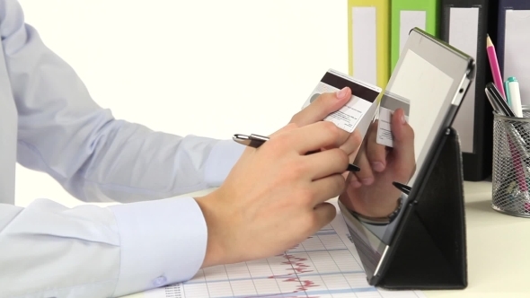 Businessman Is Paying With Credit Card By Tablet