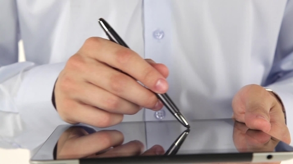 Businessman Working On Tablet Using Stylus