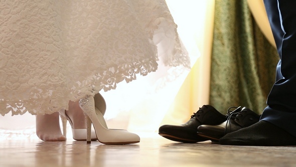 The Bride and Groom Wear Wedding Shoes