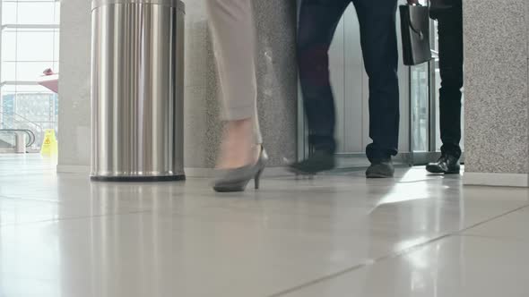 Businesspeople exiting elevator