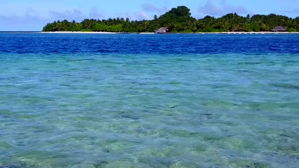 Close up texture of resort beach time by blue water and sand background near waves