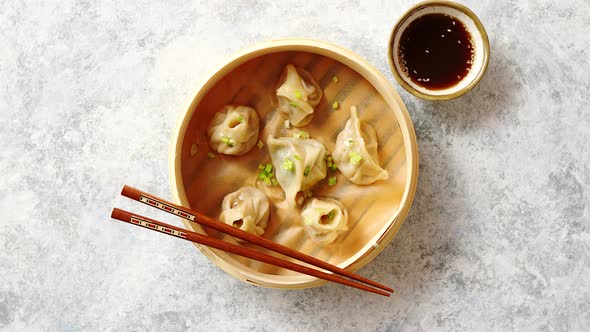 Traditional Chinese Dumplings Served in the Wooden Bamboo Steamer