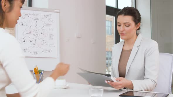 Employer Having Interview with Employee at Office 