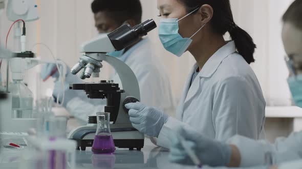 Asian Female Scientist Turning Towards Camera