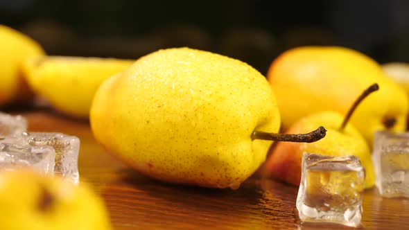 Ripe Pear on Wooden Surface with Ice