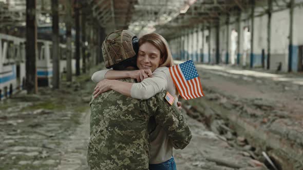 Woman with USA Flag Meeting Husband After War