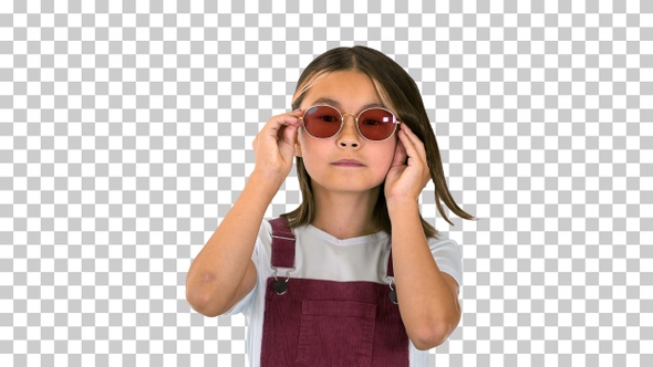 Cute little asian girl in sunglasses posing, Alpha Channel