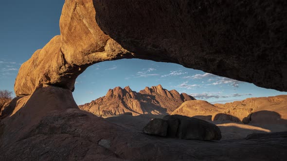 The Bridge. Pondok Mountains Seen Through The Hole Of Natural Arch Rock Formation At Spitzkoppe, Nam