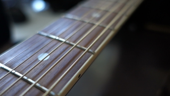 Neck Of The Guitar With The Movement Of The Camera