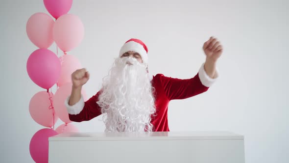 Santa Claus is Dancing Funny on a White Background
