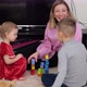mother or nanny playing with child and building from colorful blocks cubes, having fun. - VideoHive Item for Sale