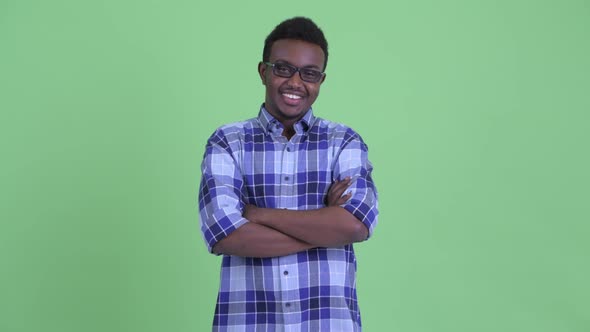 Happy Young African Hipster Man Smiling with Arms Crossed