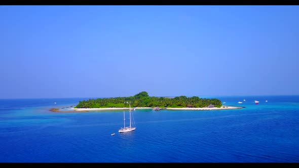 Aerial drone view landscape of idyllic island beach journey by aqua blue ocean and bright sandy back