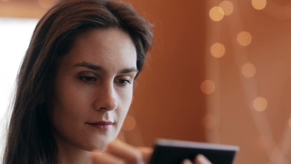 Beautiful Woman Using  Smartphone In Cafe. 