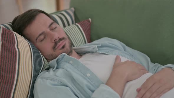 Close Up of Young Man Sleeping on Sofa