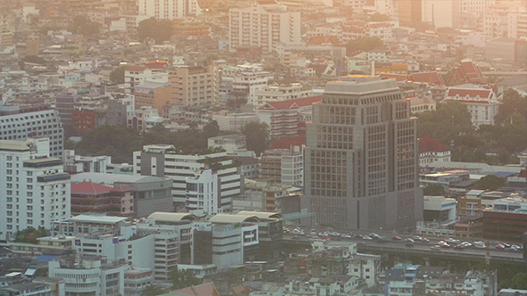 Highway Through City In Sunset Glow
