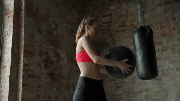 Fitness Woman Doing Exercises for the Press for Fitness with Fitness Ball in the Gym