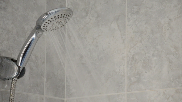 Shower Faucet Running in a Bath