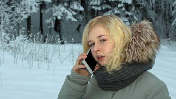 Girl Talking on the Phone in Winter