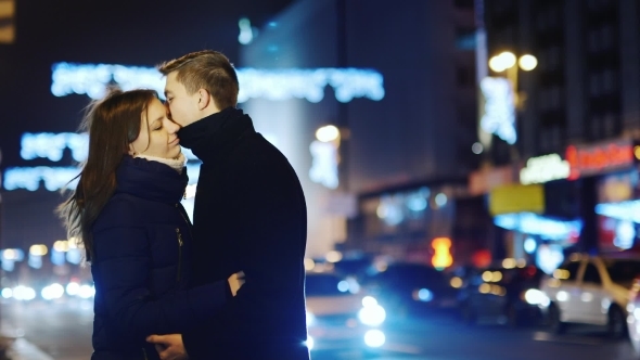 Couple In Love On The Background Of Night Traffic