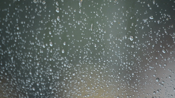 Raindrops Sliding Down in a Window