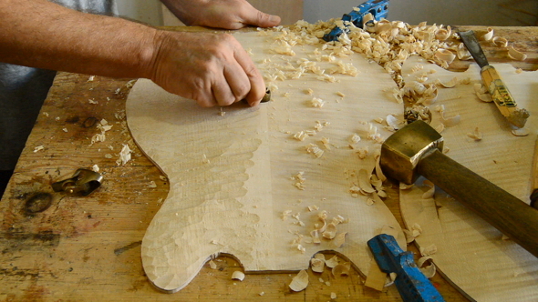 Luthier Working in a Electric Guitar