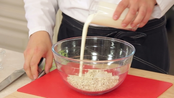 Chef Is Mixing Oat Flakes With Yogurt For Healthy
