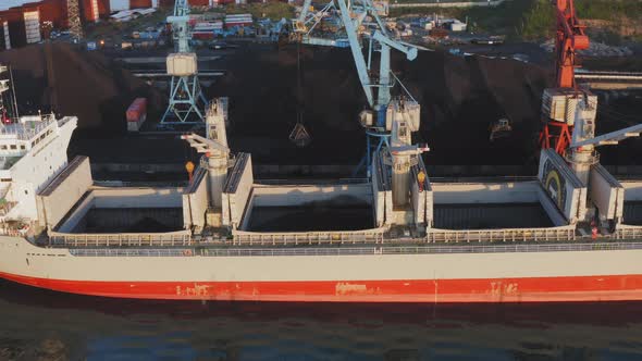 Crane Load a Big Ship with Coal