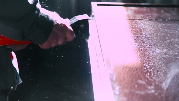 Worker Using Riveter In Doors Manufacturing alt