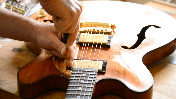 Luthier Repairing a Electric Guitar