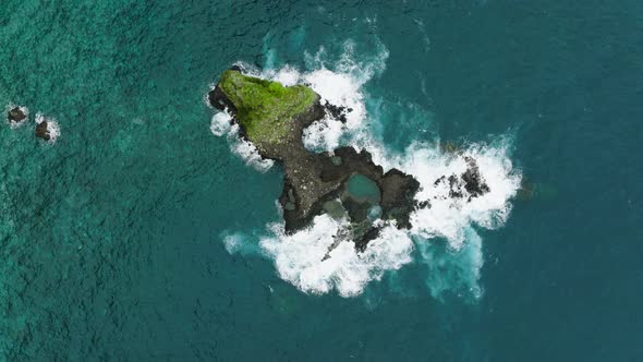 Volcanic islet in Atlantic ocean off Madeira coast; aerial top-down