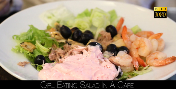 Girl Eating Salad In A Cafe 13