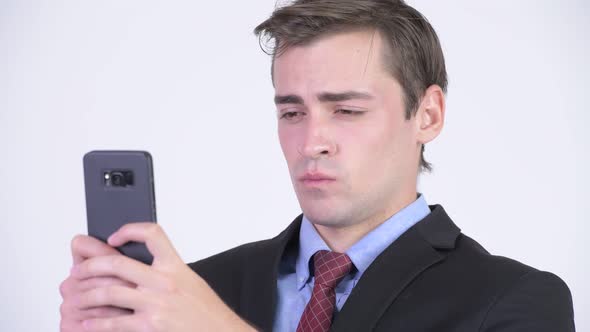 Young Happy Handsome Businessman Using Phone