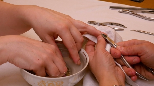 Manicure Painting And Polishing Nails In Spa Salon