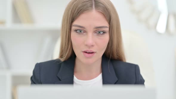 Close Up of Excited Businesswoman Celebrating Success on Laptop 