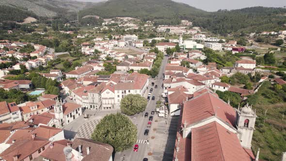 Beautiful rooftops of Arouca town surrounded by mountain range, aerial drone view