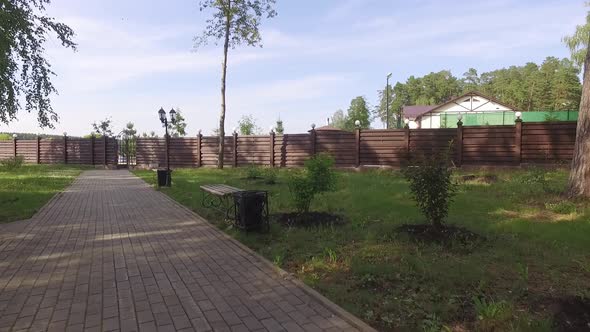 Sidewalk with Benches and Lanterns in The Forest, Recreation Center on The Lake 02