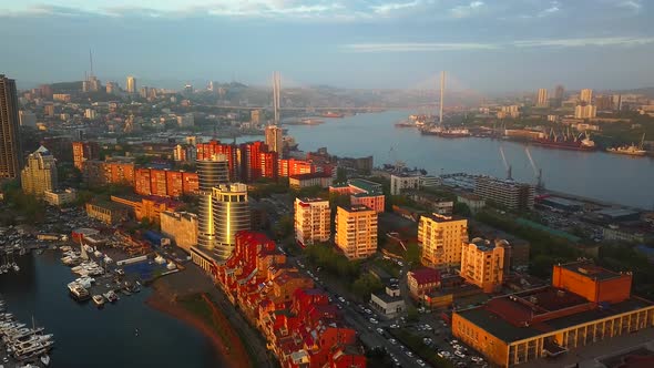 Drone View of the City and Marina Located on the Peninsula at Sunset