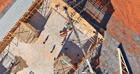 The Construction with Crane Holds Detailed of a Wooden Roof Truss Overlap Construction an Top View