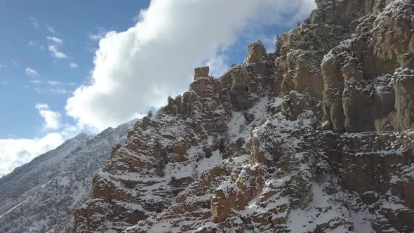 Rocky mountain side covered in snow