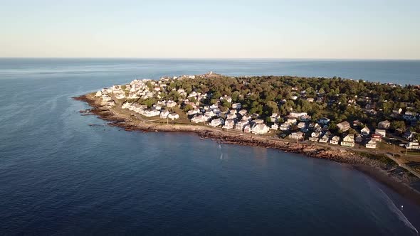 Aerial drone video of the ocean coastline and homes at Short Sands Beach near Cape Neddick and York,