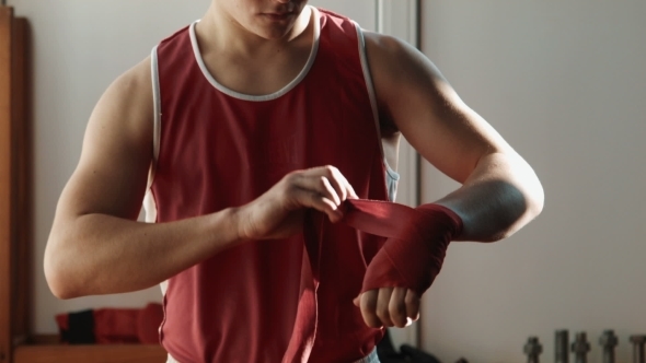 The Young Boxer Wrap Red Bandage On Hands