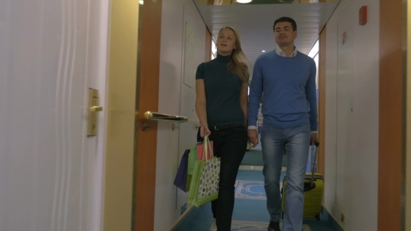 Young Couple Moving Into Hotel Room
