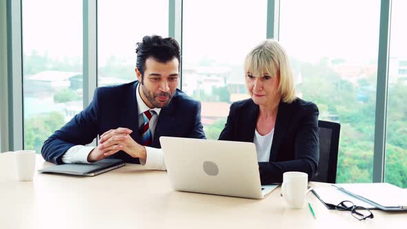 Two Happy Business People Celebrate at Office