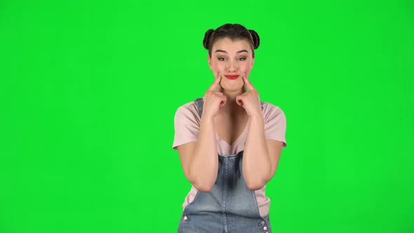 Trendy Girl Poses for Camera Makes Funny Faces on Green Screen at Studio