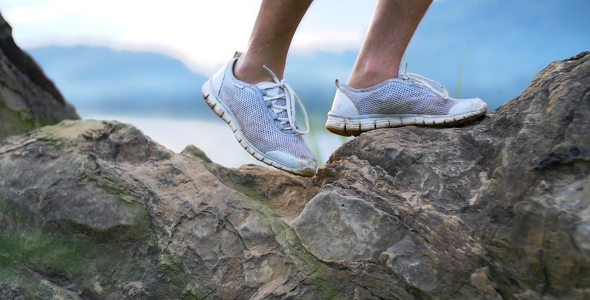 Shoes Walking On Rock