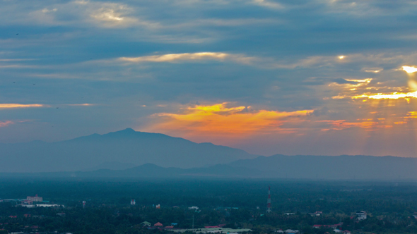 Passing Cloud with Sunlight Through The Sky at Evining