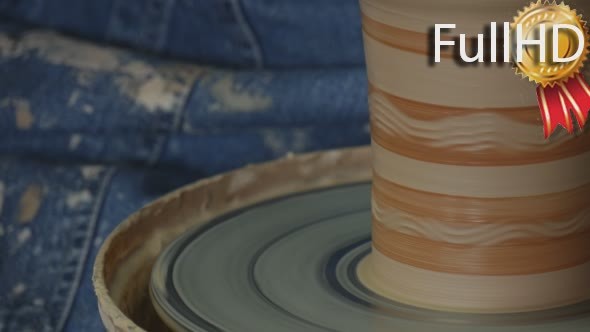 Potter Female Craftsman is Glazing Painting a Pot